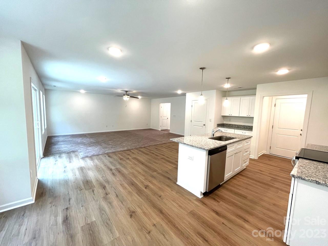 2173 Country Club Drive Lancaster, SC 29720 - Photo 7 of 18 a large kitchen with granite countertop a large counter top and stainless steel appliances