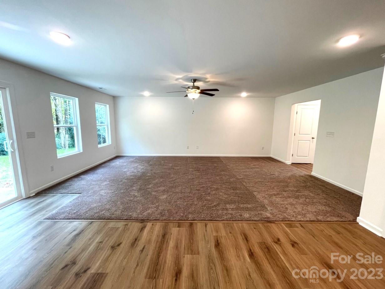 2173 Country Club Drive Lancaster, SC 29720 - Photo 8 of 18 wooden floor in an empty room with a window