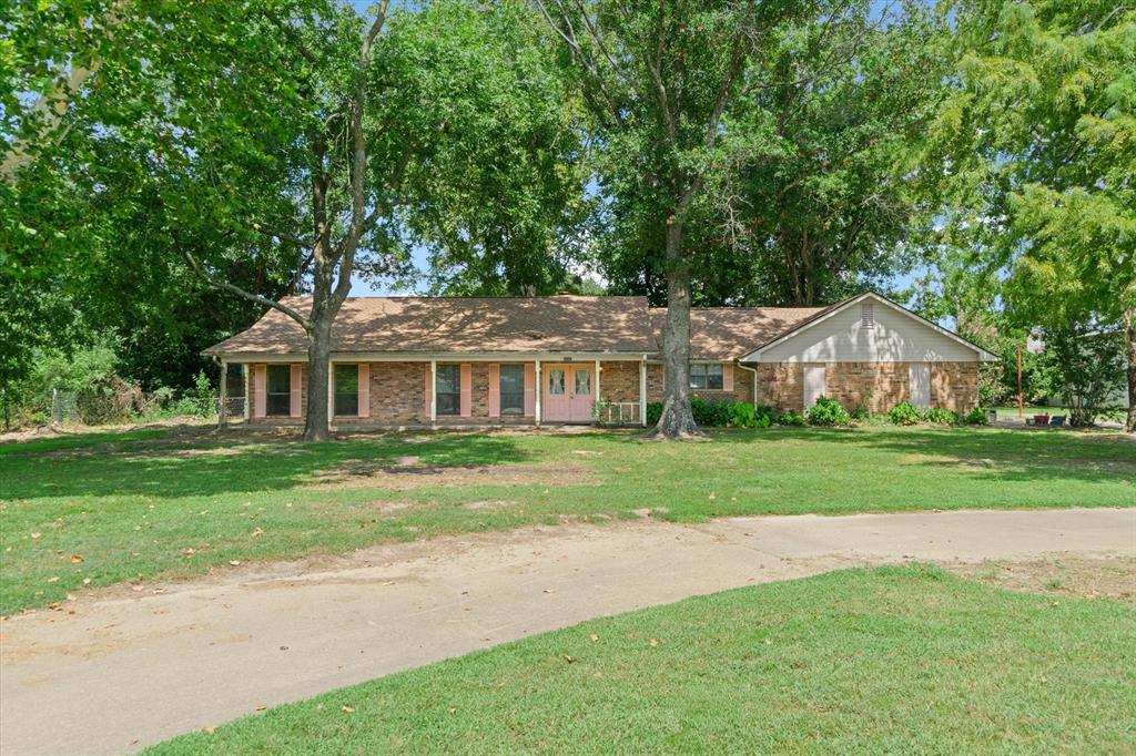20880 State Highway 64 Canton, TX 75103 - Photo 1 of 36 a front view of a house with a yard
