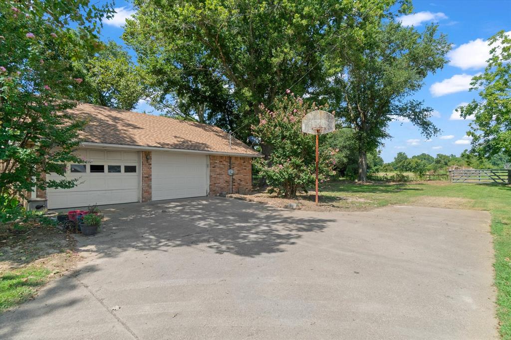 20880 State Highway 64 Canton, TX 75103 - Photo 27 of 36 a view of a house with a yard and large tree