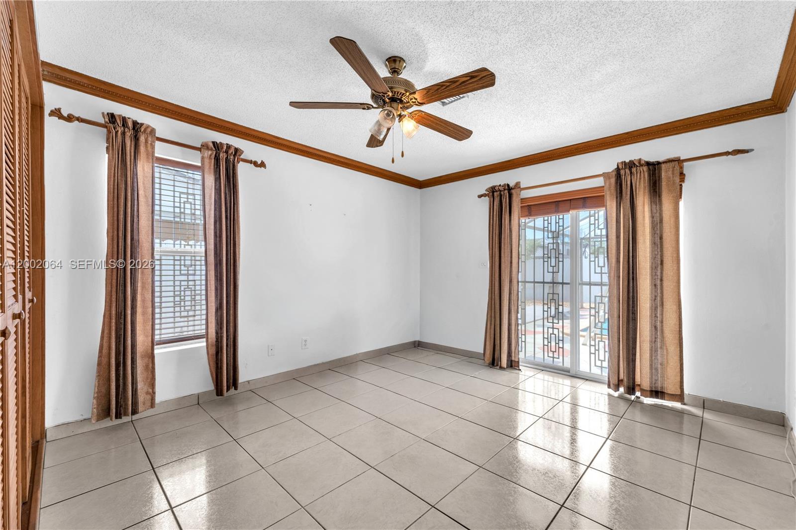 12310 Southwest 39th Terrace Miami, FL 33175 - Photo 17 of 42 a view of an empty room with a window