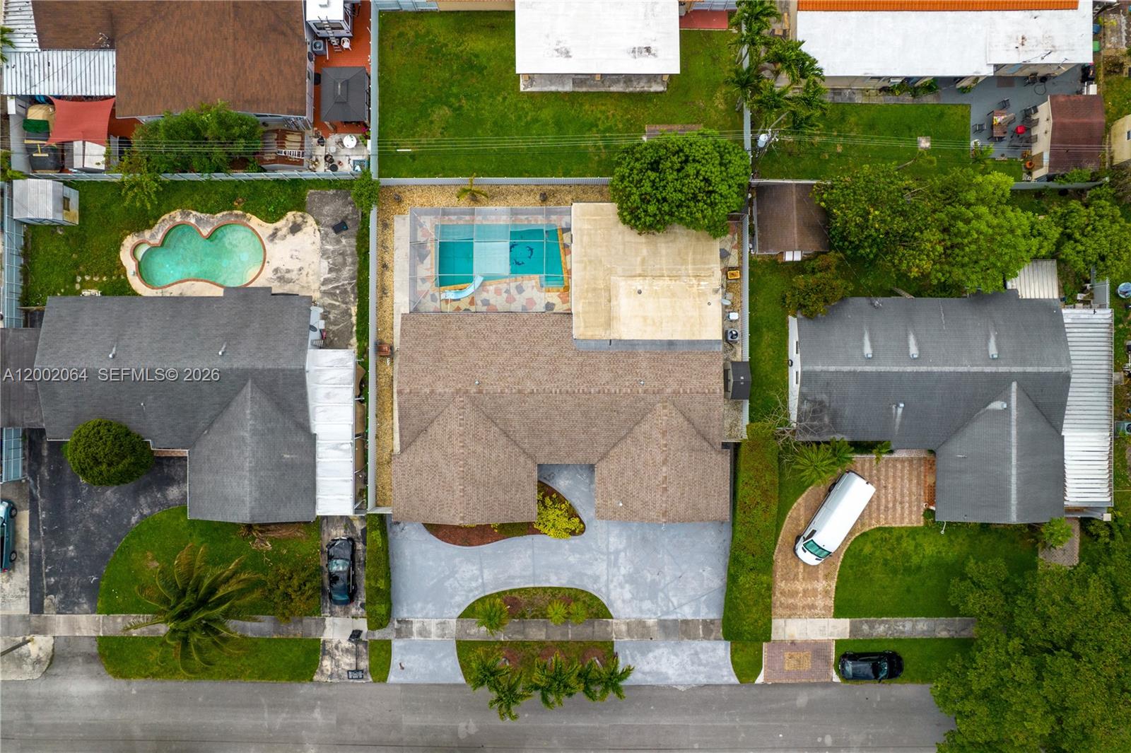 12310 Southwest 39th Terrace Miami, FL 33175 - Photo 38 of 42 an aerial view of a house with a swimming pool
