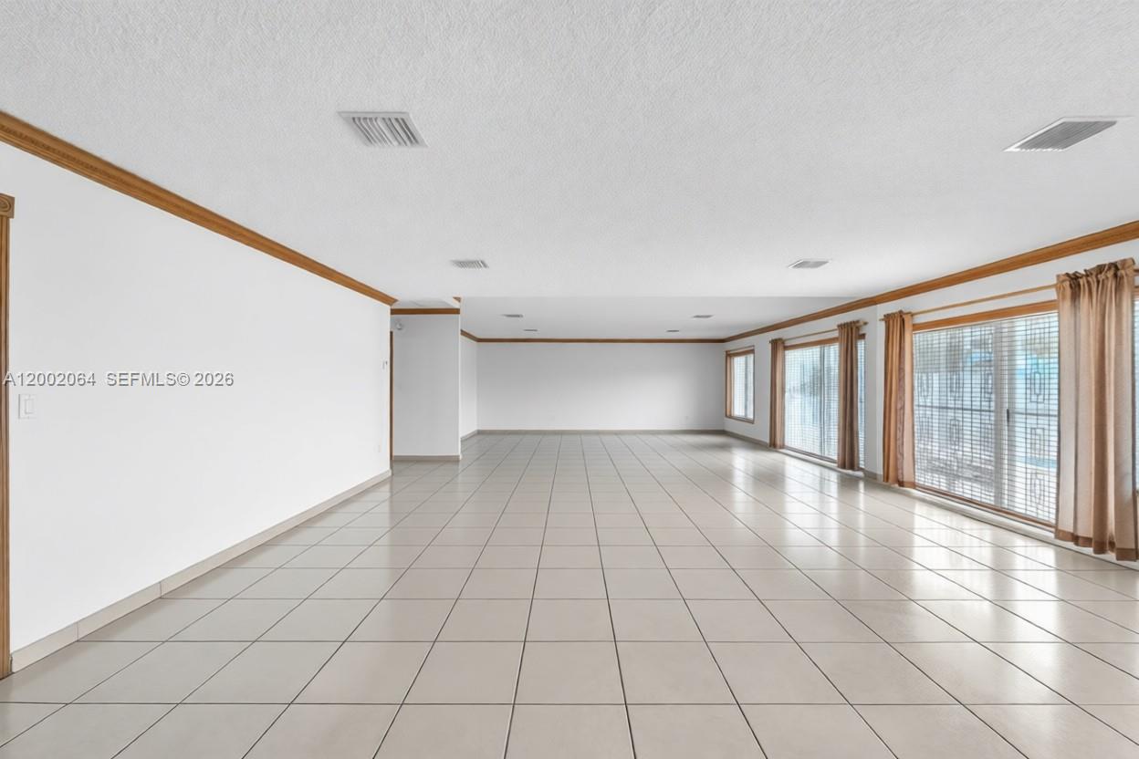 12310 Southwest 39th Terrace Miami, FL 33175 - Photo 5 of 42 a view of an empty room with a window