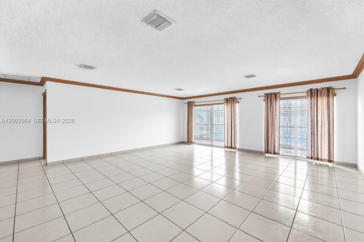 12310 Southwest 39th Terrace Miami, FL 33175 - Photo 6 of 42 a view of an empty room with a window