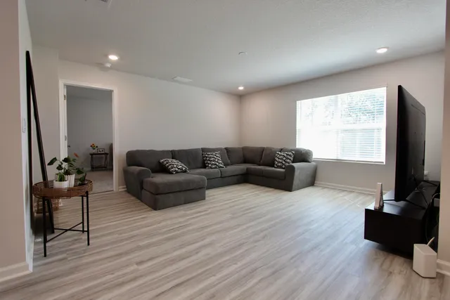 a bathroom with double vanity and a mirror