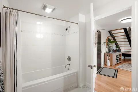 a bathroom with a bathtub and a shower