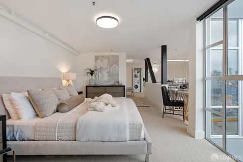 a large white bed in a white room