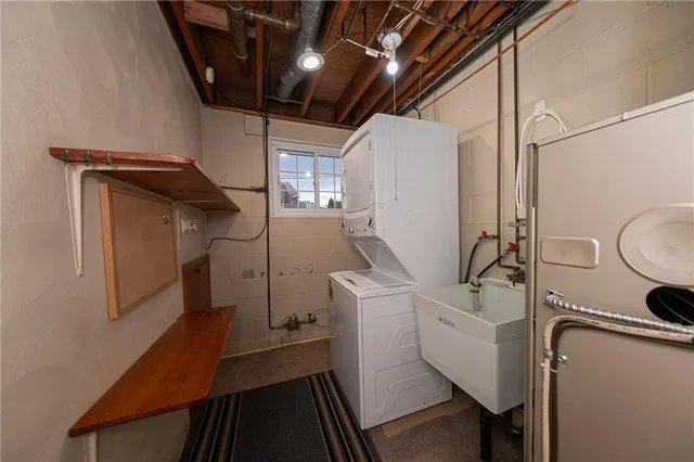 a view of a storage and utility room with racks on the wall