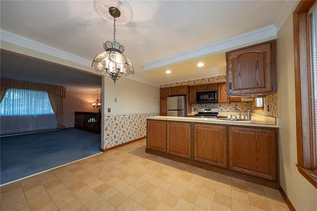 a kitchen with sink and cabinets