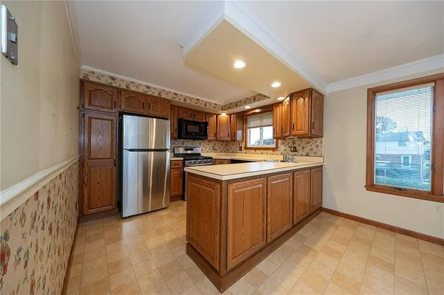 a kitchen with cabinets and refrigerator
