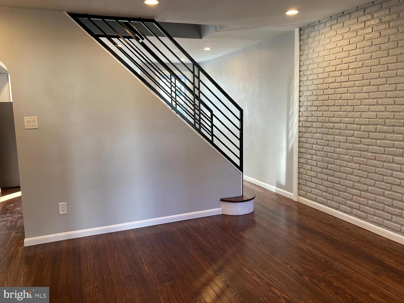 28 Locust Street Merchantville, NJ 08109 - Photo 3 of 10 a view of an empty room with wooden floor
