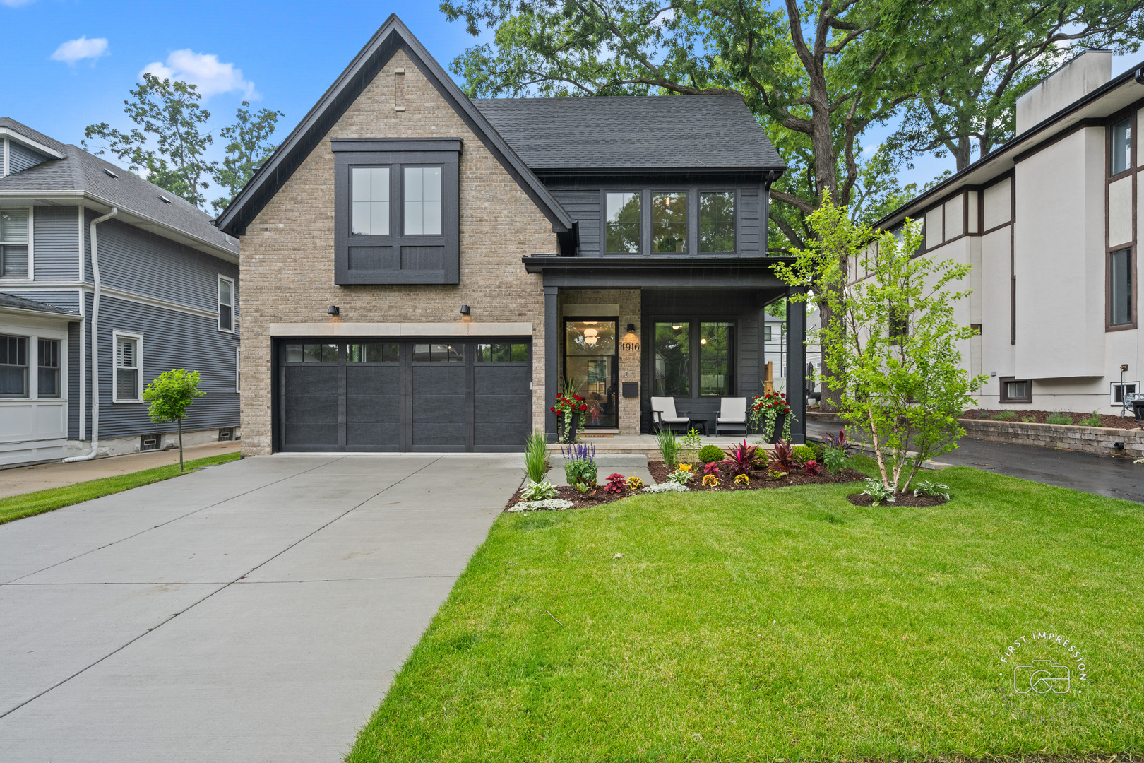 a view of a house with a yard and sitting area