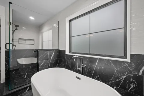 a bathroom with a double vanity sink and mirror