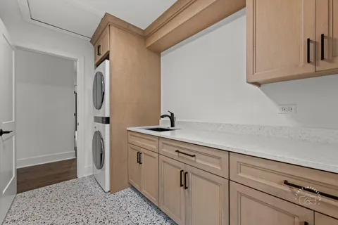 a kitchen with a sink and refrigerator