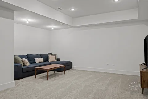 a living room with furniture and a rug