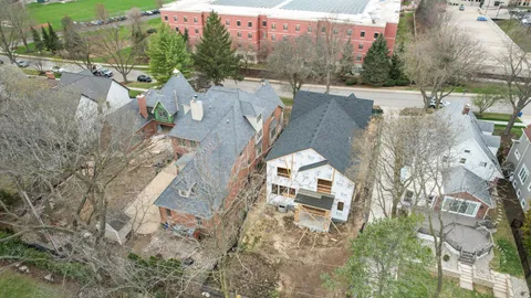 an aerial view of houses with outdoor space