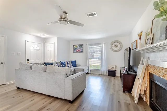 a living room with furniture and a fireplace