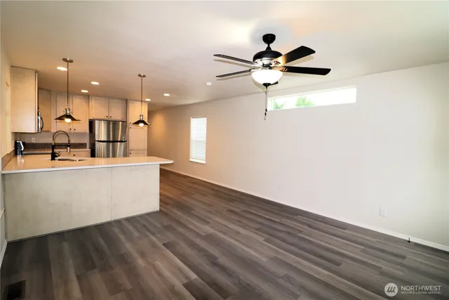 a view of kitchen with wooden floor and window