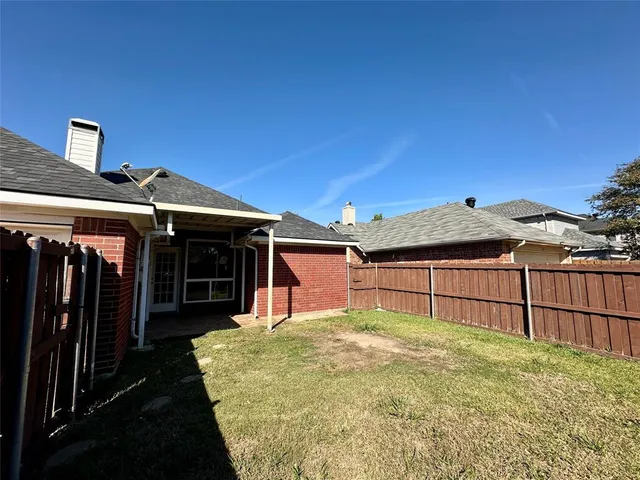 a view of a backyard with a small cabin