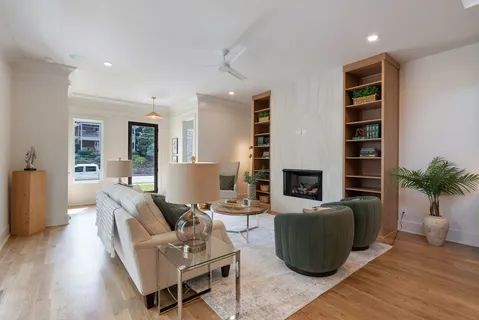 a bathroom with a granite countertop sink a toilet and shower