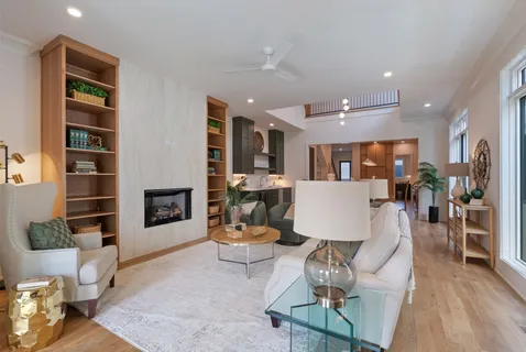 a en suite bathroom with a granite countertop sink and a mirror
