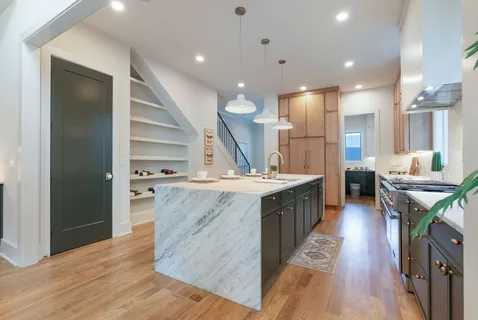 an empty room with wooden floor and a window