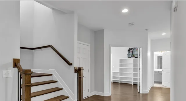 a kitchen with kitchen island granite countertop a sink stainless steel appliances and cabinets
