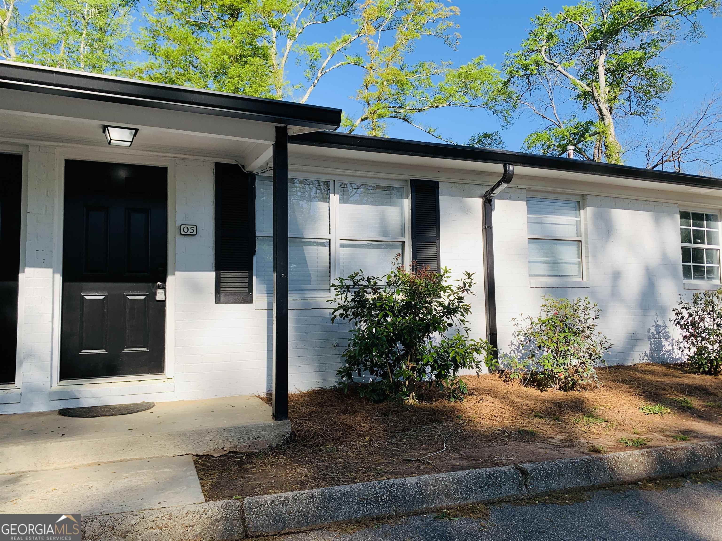 438 North 5th Street, Unit 1 Griffin, GA 30223 - Photo 1 of 1 a front view of a house with garden