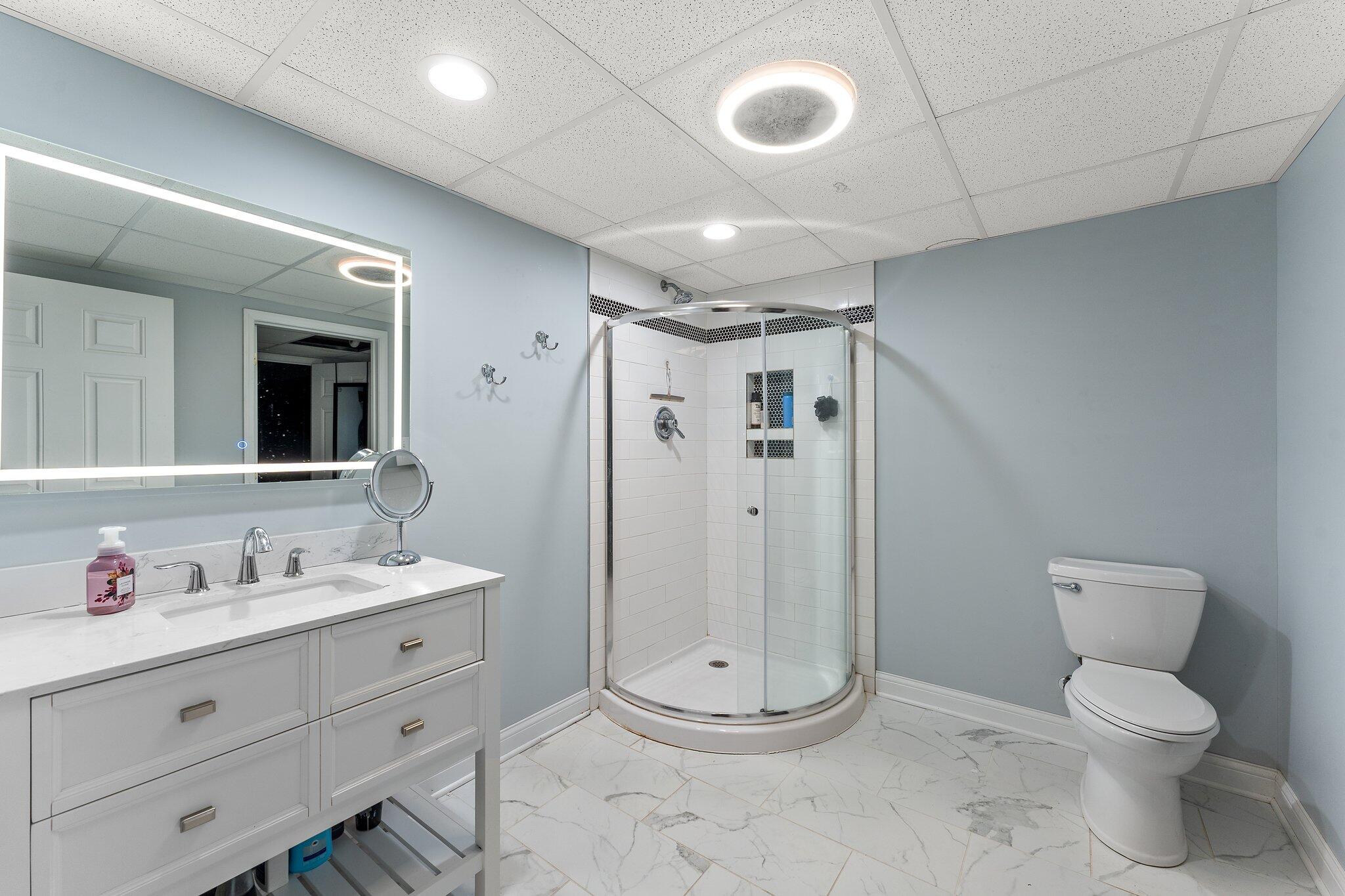 11728 Monroe Place Crown Point, IN 46307 - Photo 26 of 44 a bathroom with a toilet sink and shower