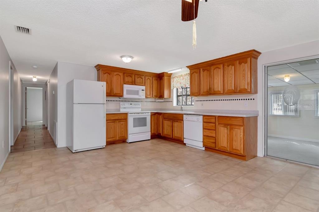 349 Old Welcome Road Lithia, FL 33547 - Photo 12 of 54 a kitchen with a refrigerator sink and microwave