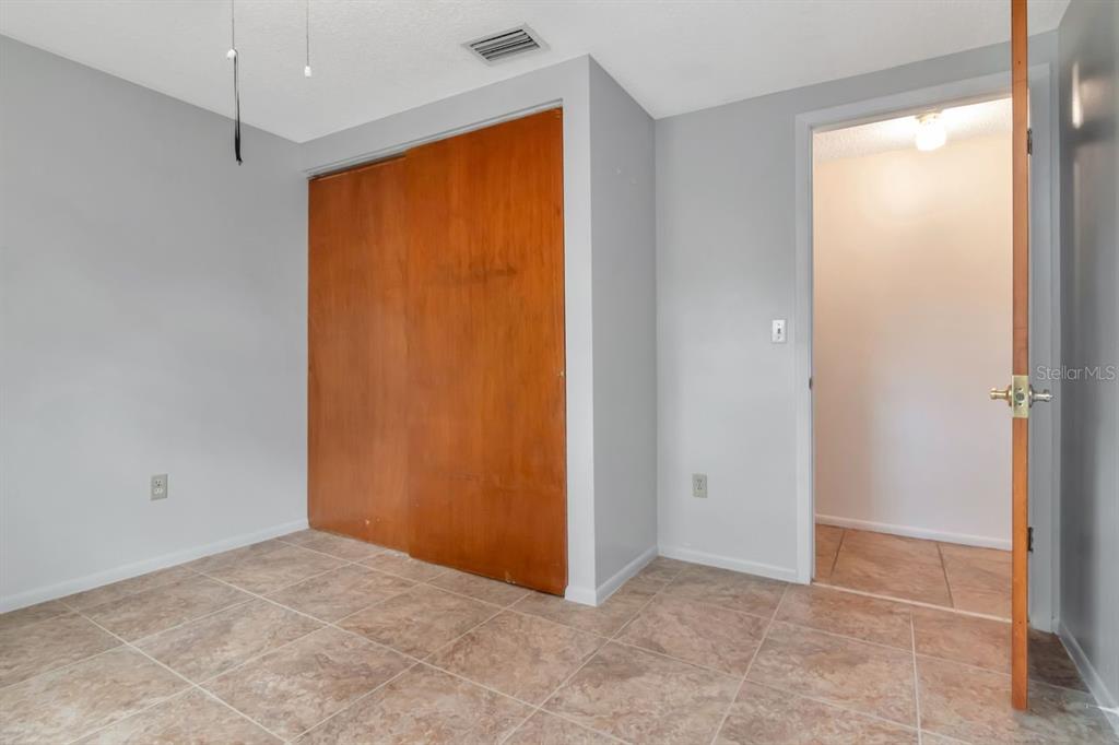 349 Old Welcome Road Lithia, FL 33547 - Photo 29 of 54 an empty room with closet area