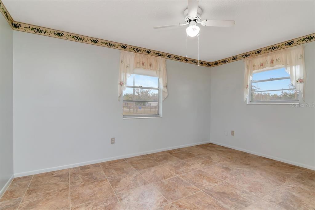 349 Old Welcome Road Lithia, FL 33547 - Photo 31 of 54 a view of a room with window and ceiling fan