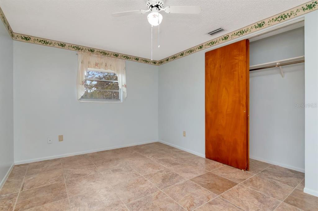 349 Old Welcome Road Lithia, FL 33547 - Photo 32 of 54 a view of a big room with a chandelier fan and closet