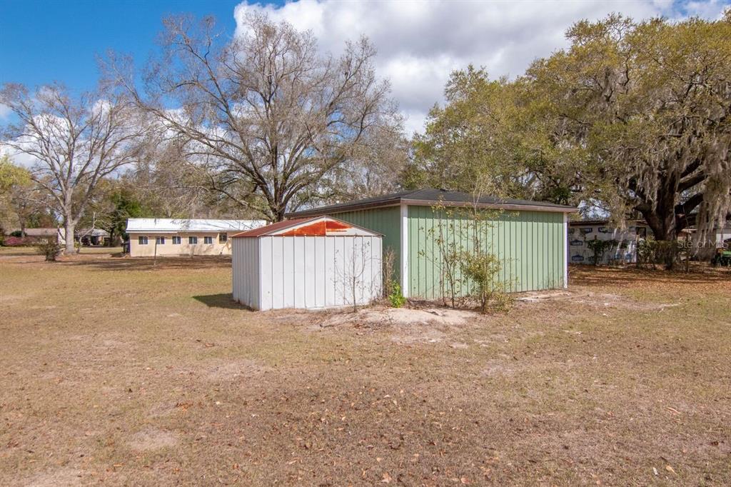 349 Old Welcome Road Lithia, FL 33547 - Photo 34 of 54 a view of a house with a yard and garage