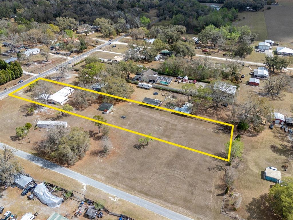 349 Old Welcome Road Lithia, FL 33547 - Photo 4 of 54 a view of swimming pool with a yard and seating area