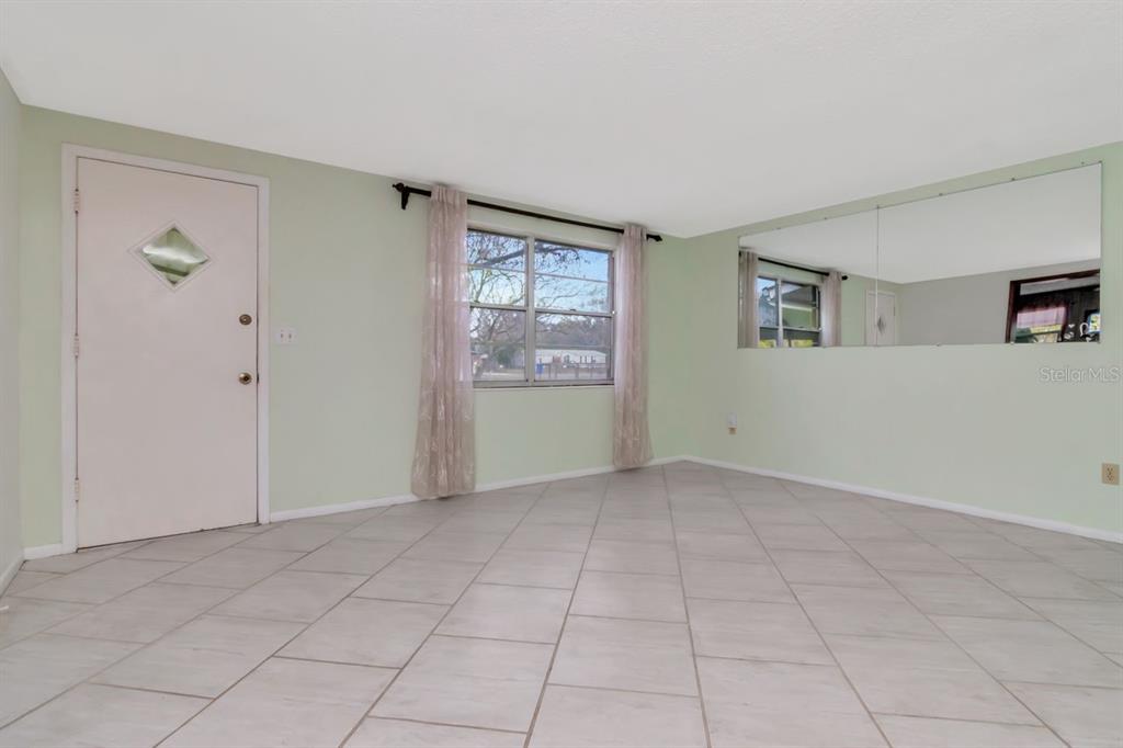 349 Old Welcome Road Lithia, FL 33547 - Photo 7 of 54 a view of an empty room with a window