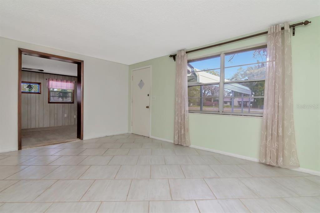 349 Old Welcome Road Lithia, FL 33547 - Photo 8 of 54 a view of an empty room with a window