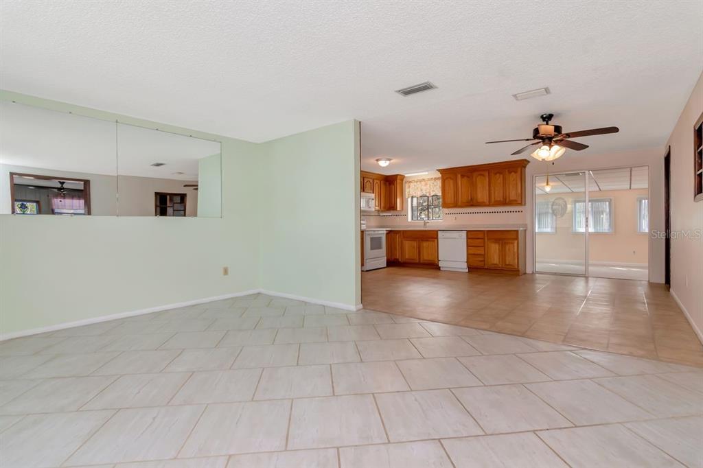349 Old Welcome Road Lithia, FL 33547 - Photo 10 of 54 a view of a livingroom with furniture and an empty room
