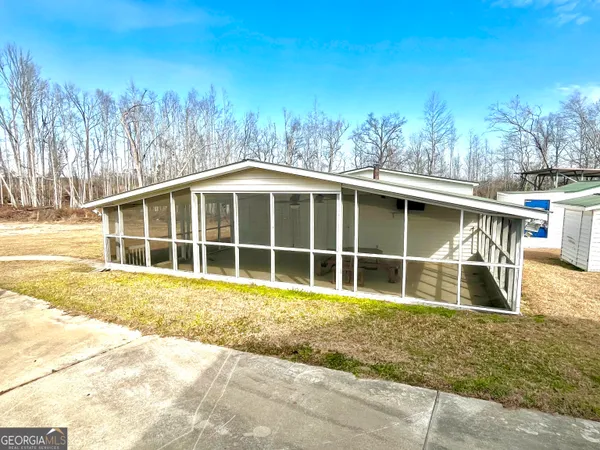 a house with trees in the background