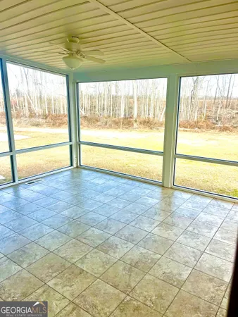 a view of an empty room and window