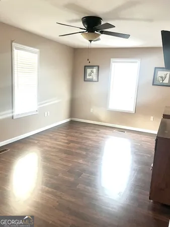 a view of an empty room and window