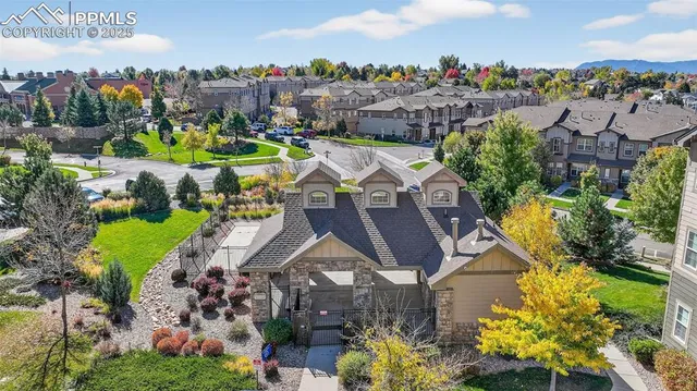 a view of a house with a garden and a swimming pool