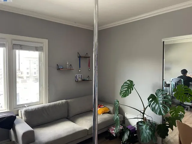 a living room with furniture and flowers