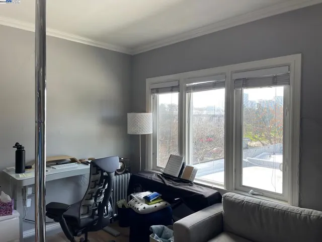 a living room with furniture and a window