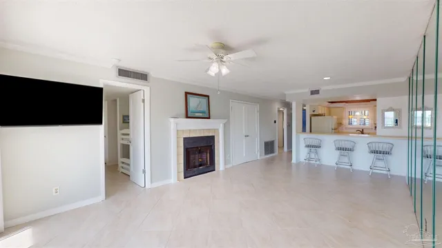 a view of a livingroom with an empty space and a fireplace
