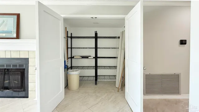 a view of a hallway with seating space