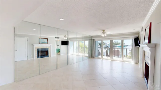 a view of a hallway with wooden cabinet and stainless steel appliances