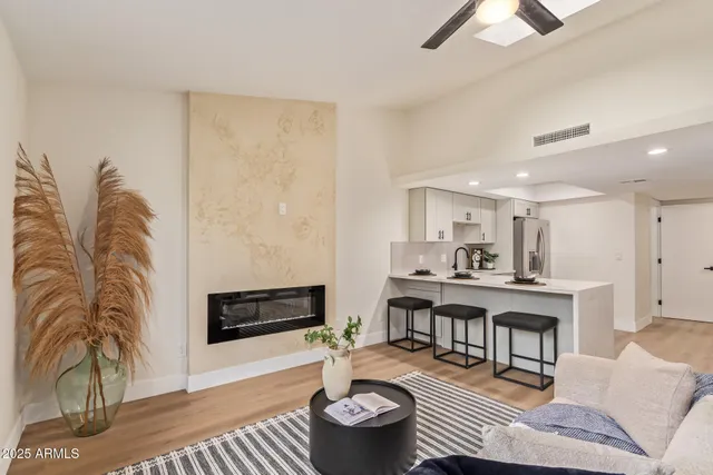a living room with furniture and a fireplace