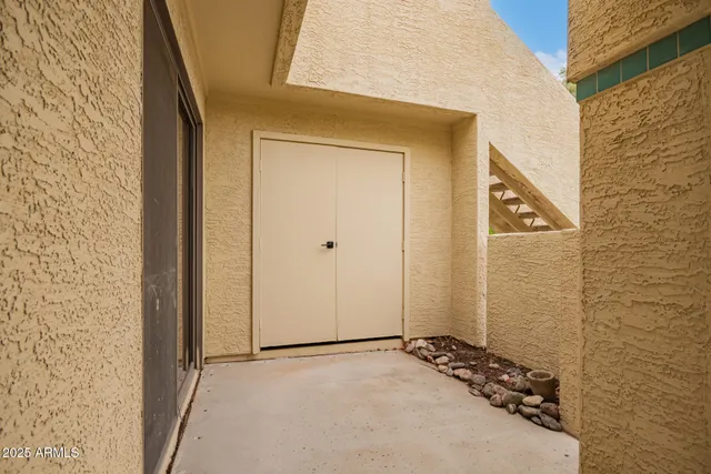 a view of a bathroom with a glass door and shower