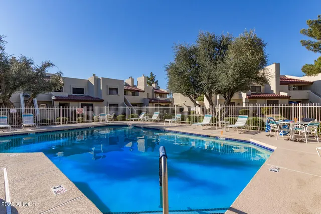 a front view of a building with sitting area
